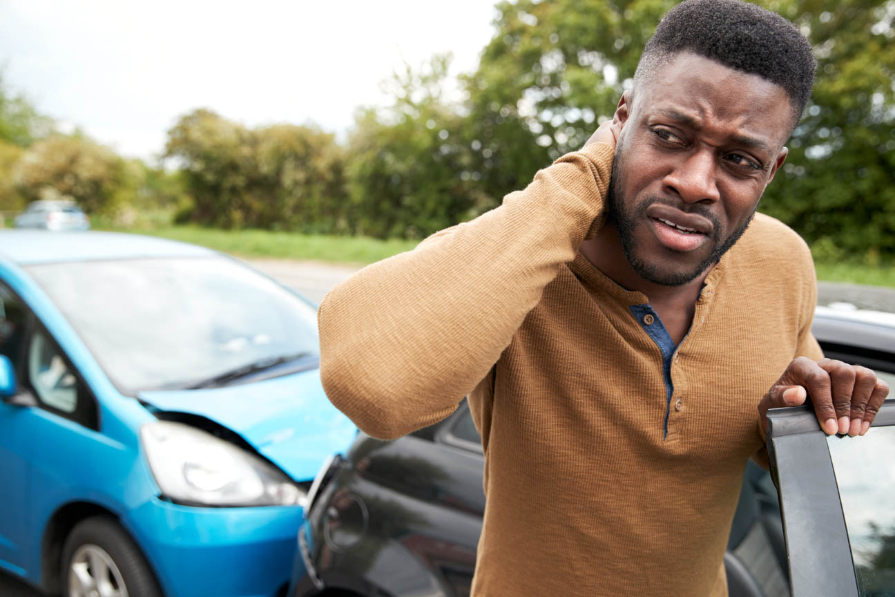 Man suffering from whiplash as a result of a car accident