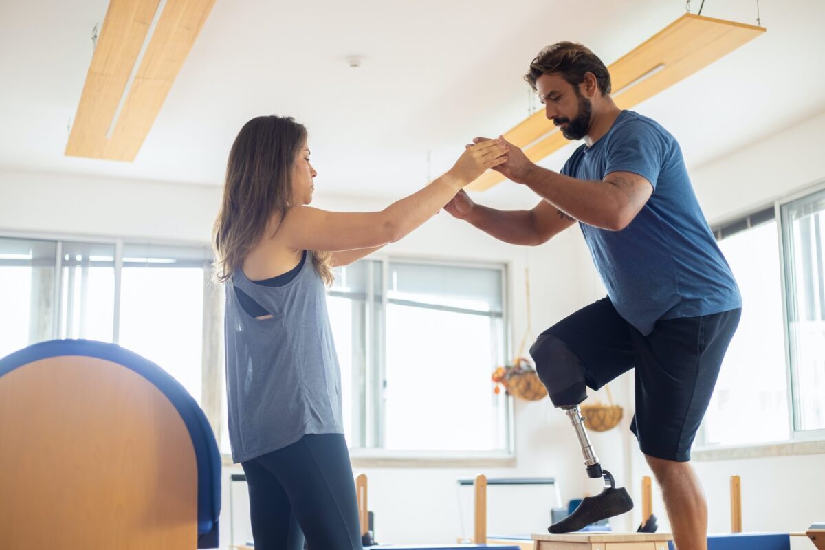 Man with traumatic amputation doing physical therapy